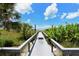 Convenient boardwalk path leads to sandy beach at 8779 Midnight Pass Rd # 206H, Sarasota, FL 34242