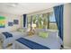 Guest bedroom with two twin beds and waterfront views at 8779 Midnight Pass Rd # 206H, Sarasota, FL 34242