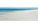 Wide, sandy beach with calm ocean waters at 8779 Midnight Pass Rd # 206H, Sarasota, FL 34242