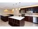 Modern kitchen with island and stainless steel appliances at 8779 Midnight Pass Rd # 206H, Sarasota, FL 34242
