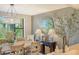 Elegant dining area with chandelier and view to water at 8779 Midnight Pass Rd # 206H, Sarasota, FL 34242