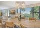 Bright dining room featuring a large table and scenic views at 8779 Midnight Pass Rd # 206H, Sarasota, FL 34242