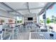 Outdoor bar area with tables and chairs, ready for entertaining at 8779 Midnight Pass Rd # 206H, Sarasota, FL 34242