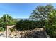 Wooden walkway leading to a dock with water access at 8779 Midnight Pass Rd # 206H, Sarasota, FL 34242