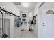 Well-organized storage room with shelving and hanging racks at 980 Cooper St # 302, Venice, FL 34285