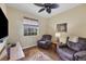 Comfortable den with two leather recliners and a large TV at 980 Cooper St # 302, Venice, FL 34285