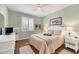 Guest bedroom with a queen-size bed and wood floors at 980 Cooper St # 302, Venice, FL 34285