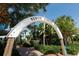 Archway entrance to Venice Fishing Pier, surrounded by lush tropical foliage at 980 Cooper St # 302, Venice, FL 34285