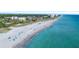 Aerial view of beach with turquoise water and people enjoying the sun at 980 Cooper St # 302, Venice, FL 34285