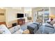 Living room with comfy seating and hardwood floors at 980 Cooper St # 302, Venice, FL 34285