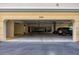 Covered parking garage with several cars parked at 980 Cooper St # 302, Venice, FL 34285