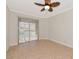 Spacious bedroom with sliding doors and tile floor at 10550 Old Grove Cir, Bradenton, FL 34212