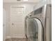 Laundry room with side-by-side washer and dryer at 10550 Old Grove Cir, Bradenton, FL 34212
