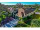 One-story green house with brown roof, landscaping, and a driveway at 10550 Old Grove Cir, Bradenton, FL 34212