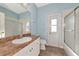 Bathroom with single sink, shower/tub combo, and exterior access at 10550 Old Grove Cir, Bradenton, FL 34212