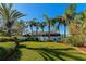 Landscaped backyard with lush greenery and privacy fence at 10550 Old Grove Cir, Bradenton, FL 34212