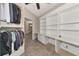 Spacious walk-in closet with built-in shelving and adjacent office at 10550 Old Grove Cir, Bradenton, FL 34212