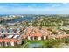 Aerial view of condo community with tennis court and pool at 1624 Stickney Point Rd # 401, Sarasota, FL 34231