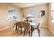 Bright dining room with lots of natural light and seating for four at the table at 16606 Barnwood Pl, Bradenton, FL 34211