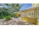 Exterior view of the house with wooden deck, and detached garage at 1920 Laurel St, Sarasota, FL 34236