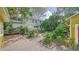 Landscaped backyard with a wooden deck and lush greenery at 1920 Laurel St, Sarasota, FL 34236