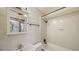 Clean bathroom with a tub, shower, and white tile at 1920 Laurel St, Sarasota, FL 34236