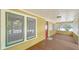Inviting front porch with wood flooring and screened sides at 1920 Laurel St, Sarasota, FL 34236