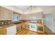 Well-lit kitchen with wooden cabinets, a tile backsplash, and modern appliances at 1920 Laurel St, Sarasota, FL 34236