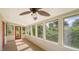 Bright and airy sunroom with many windows offering views of the lush landscaping at 1920 Laurel St, Sarasota, FL 34236