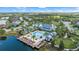 Resort-style community pool with clubhouse and adjacent lake at 2520 Avolet Ct, Bradenton, FL 34211