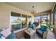 Covered patio with comfortable seating and view of the lake at 2520 Avolet Ct, Bradenton, FL 34211