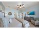 Bright main bedroom with king-size bed, dresser, and access to the bathroom at 2520 Avolet Ct, Bradenton, FL 34211