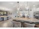 Open kitchen with large island, white cabinets, and stainless steel appliances at 2520 Avolet Ct, Bradenton, FL 34211