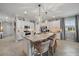 Modern kitchen with granite island, white cabinets, and stainless steel appliances at 2520 Avolet Ct, Bradenton, FL 34211