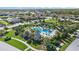 Community pool and clubhouse surrounded by lush landscaping at 2520 Avolet Ct, Bradenton, FL 34211