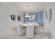 Elegant dining room with round table and modern chandelier at 2520 Avolet Ct, Bradenton, FL 34211