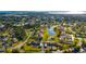Expansive aerial view of a community with lake, pool, and lush green landscaping at 2812 Heritage Ln # 2812, Bradenton, FL 34209