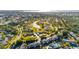 Scenic aerial view showcasing the community, lush landscaping, and peaceful lake at 2812 Heritage Ln # 2812, Bradenton, FL 34209