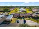 Aerial view of a charming community with a pool, pond, lush landscaping, and convenient parking at 2812 Heritage Ln # 2812, Bradenton, FL 34209