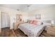 Inviting bedroom featuring neutral tones, wood-look floors, and a comfortable bed at 2812 Heritage Ln # 2812, Bradenton, FL 34209