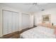 Spacious bedroom with ample closet space, wood-look floors, and a large window at 2812 Heritage Ln # 2812, Bradenton, FL 34209