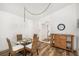 Elegant dining area with a glass table, wicker chairs, and ample lighting at 2812 Heritage Ln # 2812, Bradenton, FL 34209