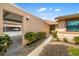Inviting exterior featuring a covered walkway, mature landscaping, and convenient carport access at 2812 Heritage Ln # 2812, Bradenton, FL 34209