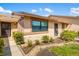 Charming exterior view with well-manicured landscaping, neutral color scheme, and inviting entryway at 2812 Heritage Ln # 2812, Bradenton, FL 34209