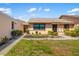 Attractive exterior with well-kept lawn, mature shrubbery, and neutral color scheme creating a welcoming curb appeal at 2812 Heritage Ln # 2812, Bradenton, FL 34209
