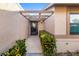 Inviting front entrance with well-maintained landscaping, covered entry, and neutral-toned exterior at 2812 Heritage Ln # 2812, Bradenton, FL 34209