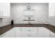 Well-lit kitchen with a modern sink, marble backsplash, and stylish fixtures at 2812 Heritage Ln # 2812, Bradenton, FL 34209
