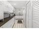Modern kitchen with white cabinets, stainless steel appliances, and stylish backsplash at 2812 Heritage Ln # 2812, Bradenton, FL 34209