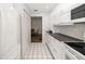 Clean kitchen featuring white cabinets, modern appliances, and convenient access to dining area at 2812 Heritage Ln # 2812, Bradenton, FL 34209