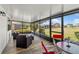 Enclosed lanai with comfortable seating area and views of the well-maintained backyard at 2812 Heritage Ln # 2812, Bradenton, FL 34209